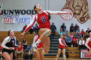 Dunwoody's Paige McKnight (8) goes up for a kill against Creekview. (Photo by Mark Brock)