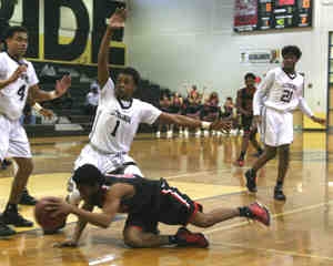 Lithonia's Rodney Chatman (1) plays defense against Cairo. (Photo by Mark Brock)