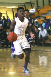Miller Grove's Joshua Jackmon heads to the basket following a steal against Statesboro. (Photo by Mark Brock)