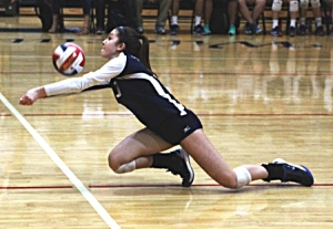 Dunwoody's Amanda Gild dives to keep a ball in action against Lanier. (Photo by Mark Brock)