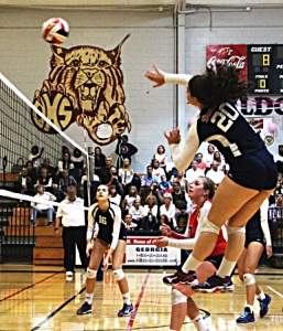 Dunwoody's Bridget Boyle goes for a kill in second round playoff action against Lanier. (Photo by Mark Brock)