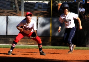 Dunwoody first baseman Lindsey Puckett plays in front of a River Ridge base runner. (Photo by Mark Brock)