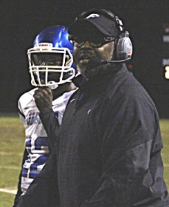 Stephenson Head Coach Ron Gartrell (right) with quarterback Xavier Sheppard during win over Miller Grove that gave Gartell his 200th career victory. (Photo by Mark Brock)