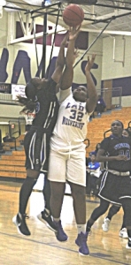 Miller Grove's Chrystal Ezechukwu shoots against Stephenson's Miracle Gray. Ezechukwu had 15 points and 21 rebounds in the upset of the No. 6 ranked Lady Jaguars. (Photo by Mark Brock)