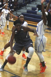 Redan's Taylor Tucker (33) drives against Columbia's KeShawn White for two of her 21 game-high points. (Photo by Mark Brock) 