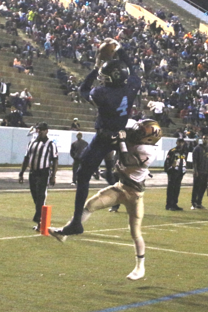 Cedar Grove's Jesse Reverio (4) reaches for pass during the Saints' 41-25 Class 3A playoff win over Westside-Macon last Friday. (Photo by Mark Brock)