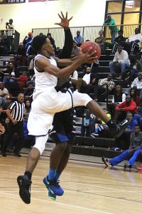 Lithonia's Rodney Chatman goes to the basket against North Clayton. (Photo by Mark Brock)