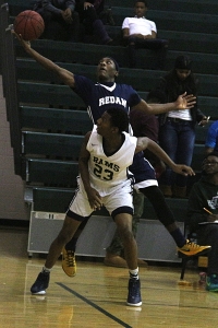 Redan's Chae McLaurin saves a ball from going out of bounds behind Arabia Mountain's Jamal Middleton (23). Redan won the DCSD title in a 44-42 thriller. (Photo by Mark Brock)