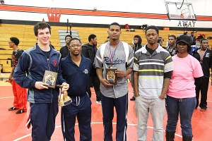 The 160 pound class final between Dunwoody's Ben Williams (far left) and Redan's Tirice Cramer (middle) was voted the Jerun Tillery Best Match Award winner. The Tillery family joins the winners. (Photo by Mark Brock)