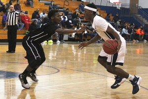 Stone Mountain's Avery Thompkins (left) defends against Redan's Chae McLaurin during the rivals' thrilling Region 6-4A overtime game at Redan. (Photo by Mark Brock)
