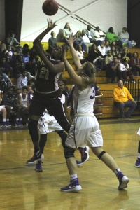 Tucker's Kierra Johnson-Graham (21) gets inside against Lakeside's Anne Elizabeth Heyse (right) in the Lady Tiger's 61-30 Region 2-6A win on Tuesday at Lakeside. (Photo by Mark Brock)