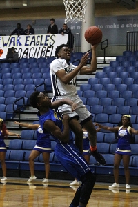 Arabia Mountain's Darius Giles (with ball) gets inside of Chamblee's Dazz Riggins during Arabia Mountain's Region 6-4A Tournament win. (Photo by Mark Brock)