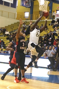 Lithonia's Derious Wimbley gets inside for a big layup during the third quarter of the Bulldogs 55-53 Elite 8 victory over Sandy Creek. (Photo by Mark Brock)