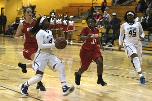 Southwest DeKalb's YaRia Sanders (4) drives the lane to the basket against Rome in the Lady Panthers first round playoff win. (Photo by Mark Brock)