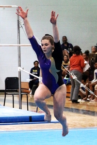 Lakeside junior Paige Munro performs in the floor exercise. Her silver medal finish on the beam pushed Lakeside to the title. (Photo by Mark Brock)