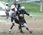 Druid Hills' Willie Jordan (left) and Lakeside's James Jackson (right) battle each other for a ground ball.