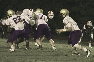Will Jernigan (with ball) runs behind several blockers vs. Dunwoody. Jernigan and the Vikings are looking to knock off the Miller Grove Wolverines on Friday. (Photo by Mark Brock)