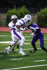 Miller Grove's Deondre Jackson (with ball) scored twice for the Wolverine's in their 22-15 loss to Lakeside. (Photo courtesy of iShootAtlanta Photography)
