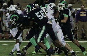 Arabia Mountain and DeKalb County leading tackler Terray Bryant (1) and Falco Johnson (56) wrap up a Villa Ricer running back. Arabia Mountain hosts No. 10 ranked Griffin on Friday at Hallford Stadium in second round Class 5A playoff action.  (Photo by Mark Brock)