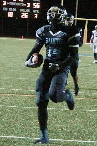 Cedar Grove's Dennis Bell returns an interception for a touchdown against first round opponent Union County. The Saints travel to face No. 5 ranked Crisp County for a berth in the Class 3A championship game. (File photo by Mark Brock)