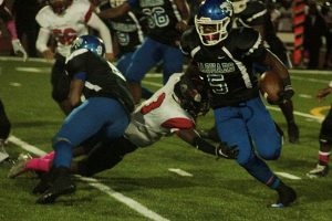 Stephenson's Jaylen Marson-Knight (5) looks for his second consecutive 1,000 yard rushing season in a key Region 4-6A game against Tucker on Friday. (File photo by Mark Brock)