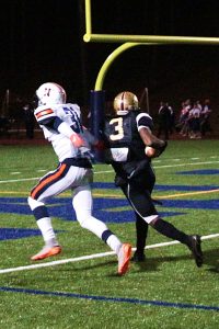 Tucker's Josh Vann (3) hauls in a 26-yard touchdown pass in front of Northside's William McCall (31). (Photo by Mark Brock)