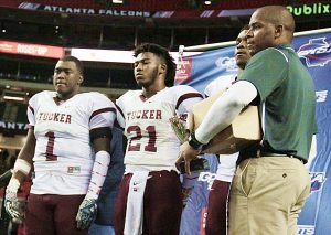 Tucker's (l-r) Chris Broadwater, Eugene Brown, Aaron Sterling and Coach Bryan Lamar accept the Class 6A runners-up trophy. (Photo by Mark Brock)