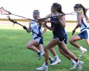 Dunwoody's Phoebe Ringers (4) draws a lot of Chamblee defenders including Kacie Lowery (5). Ringers scored 7 goals in the 16-4 Dunwoody victory.