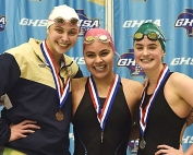 Chamblee's Jade Foelske (middle) won two gold medals at the 2018 GHSA Class 4A-5A Swimming and Diving State meet to become a four-time state championship gold medal winner. (Photo courtesy of Gib Stanfield)