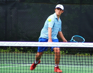 Chamblee's Allen Howell moves towards the net during his long three-set match at No. 1 singles on Wednesday. (Photo by Mark Brock)