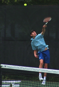 Chamblee's Jake Busch serves during his No. 2 doubles match with partner Esaan Agawal. The pair won 6-1, 6-1 at No. 2 doubles. (Photo by Mark Brock)