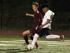 Cross Keys' Eduardo Dimas (white jersey) charges past a defender on the way to the Indians' only goal in a 2-1 Class 5A playoff loss. (Photo by Mark Brock)