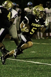 Tucker running back Tyler Hughey cuts up field on his way to a 67-yard touchdown run in the Tigers' 34-18 win over the Lovejoy Wildcats in Region 4-6A play at Adams Stadium on Friday night. (Photo by Mark Brock)