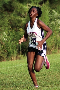 Tucker's Benitta Kawata was the first girl to cross the line in the second varsity race at Arabia Mountain. (Photo by Mark Brock)