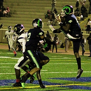 Arabia Mountain's Damion Fitzpatrick (9) comes down with an interception in the end zone against Southwest DeKalb. (Photo by Mark Brock)