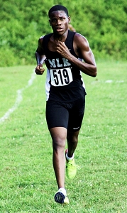 Martin Luther King Jr.'s Demetrius Carson ran a time of 17:15.99 to win the Region 4-6A boys' individual gold. (Photo by Mark Brock)