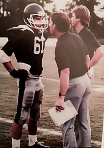 Former Redan Coach Bill Cloer (center) talks with linebacker Andy Gower and defensive coordinator Tom Clark during their 11-1-1 Region 7-4A championship season. (Photo courtesy of a former Redan player)