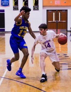 Chamblee's Zachary Mackson (13) cuts off Lakeside's Eli Chandler (14) during second half action of Lakeside's 64-59 win. (Photo by Mark Brock)