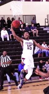 Tucker's Raylon Barrian (15) scored 10 points in a big 16-0, first quarter run by the Tigers in their opening round win over Valdosta in the Class 6A state basketball playoffs. (Photo by Mark Brock)