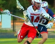 Dunwoody's Connor Brogdon (14), shown here against North Springs, had two goals and two assists in Dunwoody's historic 12-6 playoff victory over Harrison. (Photo by Mark Brock)