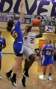 Chamblee's Kristina Perez (15) defends inside against Miller Grove's Maya Berry (20) during first half action in Miller Grove's win. (Photo by Mark Brock)