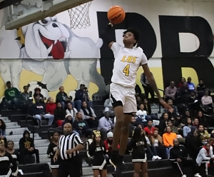 Lithonia senior guard Eric Gaines goes in for a dunk as part of his 33 points to lead the Bulldogs in a 67-58 win over Arabia Mountain at home on Tuesday night. (Photo by Mark Brock)