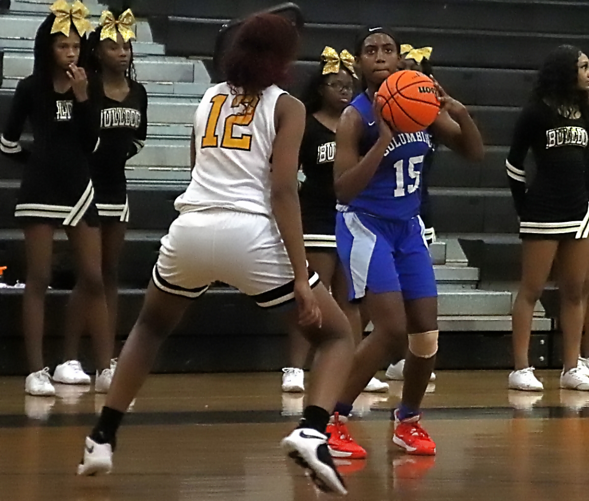 Columbia's Daija Carr (15) lines up for a three-poionter as Zaryana Mitchell (12) defends. during first half acdtion of Columbia's double-overtime win. (Photo by Mark Brock)