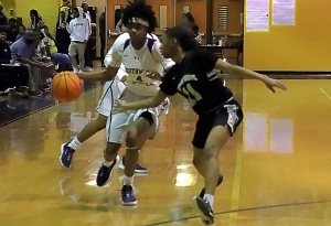 Southwest DeKalb's Pyria Thompson (4) drives against Miller Grove defender Jalisha Mann (11) in the Lady Panthers' 10th Region 5-5A victory. (Photo by Mark Brock)