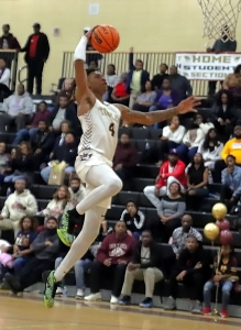 Jermontae Hill led the Tucker Tigers to a second consecutive Region 4-6A boys' title with 19 points against Lovejoy on Saturday.. (Photo by Mark Brock)