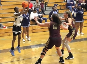 Cedar Grove's Rickayla Johnson (1) shoots a big three-pointer over Dawason County's Marlie Townley (15) during the second half come-back win for the Lady Saints. (Photo by Mark Brock)