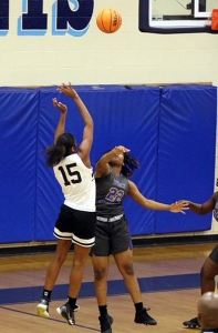 Cedar Grove's Lelah Easterly (15) gets off a shot during first half play of the Lady Saints Sweet 16 loss at the hands of No. 3 Beach. (Photo by Lester Wright)