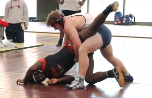 Stone Mountain's Mujahid Townes (left) and Dunwoody's Charles McCown (right) battled in the DCSD County Championships and both qualified out of sectionals for the 220 wight class in the Traditional State Wrestling Tournament this weekend. (Photo by Mark Brock)