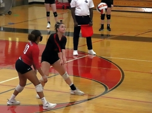 Druid Hills Aizja Rawls (10) and Ansley Glass (8) prepare for a return of serve against Cedartown in the first round of the Class 4A state playoffs. (Photo by Mark brock)