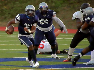 Redan quarterback Antoine Hector (5) and lineman Brandon Lester (55) put their undefeated record on the line against No. 1 ranked Cedar Grove in a 7:00 pm kickoff on Thursday at Hallford Stadium. (Photo by Mark Brock)